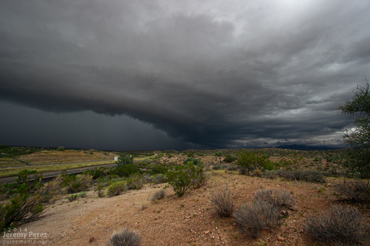 The gust front south of a supercell pushes out over Highway 93 a few miles south of I-40. View is to the north. 8:40 AM / 1540Z