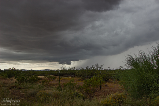 A wall cloud begins to form beside the forward flank of an approaching supercell. As seen from Highway 89 between Wickenburg and Congress looking southwest. 11:25 AM / 1825Z