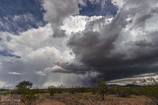 A receding supercell thunderstorm dumps rain and hail over Congress, AZ. As seen from Highway 89 looking north-northeast. 11:45 AM / 1845Z