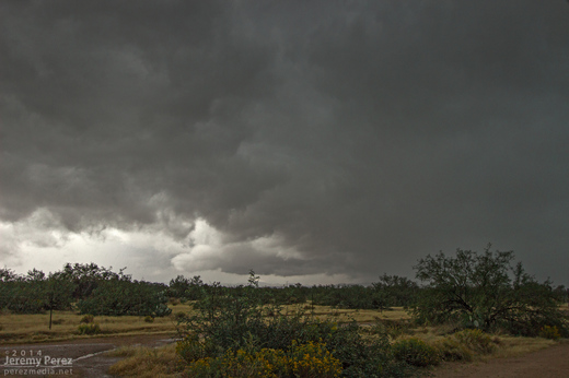 A new updraft base forms to the south of a passing supercell as seen from Highway 71 in Congress, AZ. View is to the southwest. 1:15 PM / 2015Z